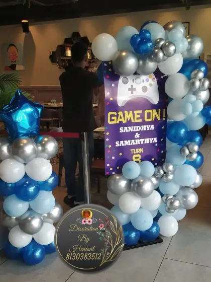 A welcome stand for the gaming party. The custom sign, which says "Game On!", is framed by a balloon arrangement that matches the main backdrop, ensuring the theme is consistent from the entrance.