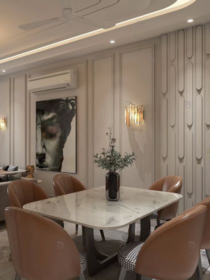 An elegant dining area in a South Delhi builder floor, featuring plush leather chairs, a marble-top table, and decorative wall paneling for a touch of modern luxury.