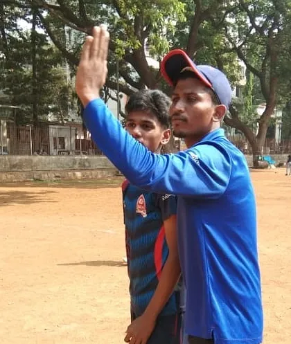 A coach providing on-field instructions during a practice session. Clear communication and a keen eye for detail are what make our coaches effective.