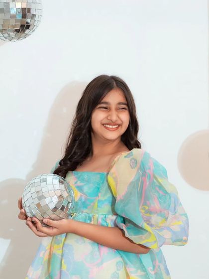 A beautiful, smiling portrait of a girl celebrating her 10th birthday. We love capturing the joy and confidence of older kids.