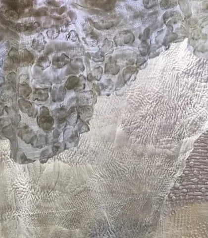 Another detail of the abstract textile art from 'Sleep Sense'. The overlapping layers of felted wool and stitched fabric create a landscape of soft, organic textures.