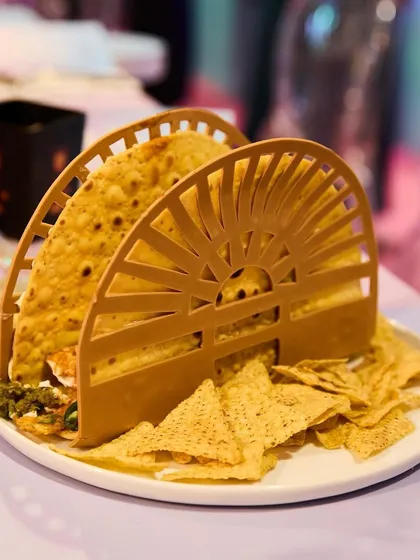 A different angle of the oversized taco, emphasizing its unique presentation and generous portion, designed to be a shareable and photogenic dish.