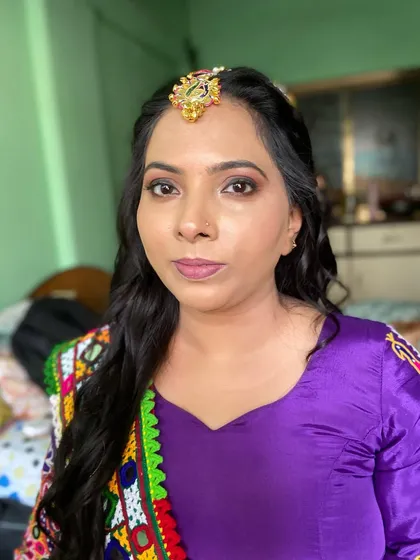 A close-up of the makeup for this client. The soft brown smokey eye and nude lip are perfect for her traditional Garba look.