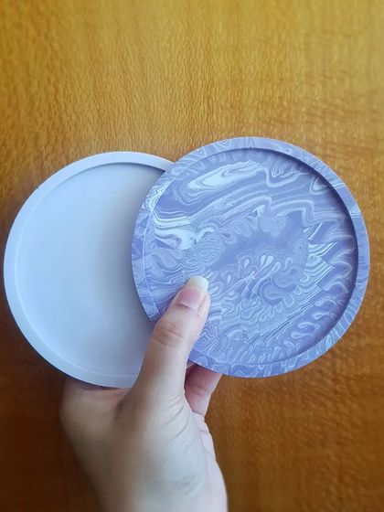 A custom order of our round coasters in a beautiful lavender and white marble finish.