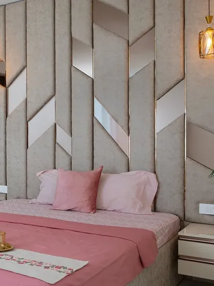 A closer look at the custom headboard, where texture and pattern play with light. The pendant lamps add a warm, ambient glow, perfect for unwinding in the evening.