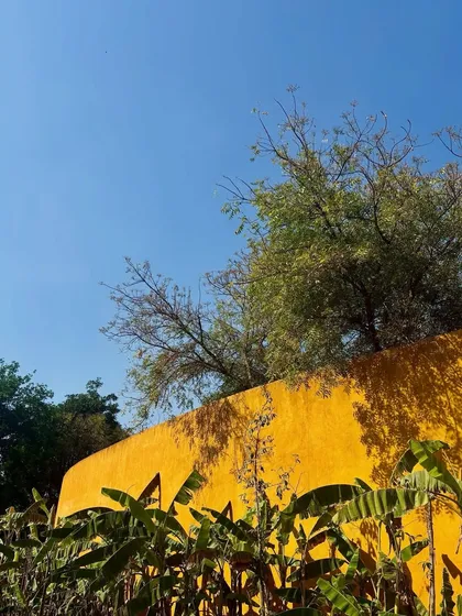 The vibrant yellow walls contrast beautifully with the deep blue sky, a sight that energizes and calms in equal measure.