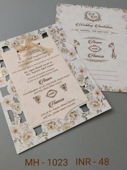 This invitation for a Nikkah ceremony features a beautiful laser-cut floral border. The main insert is shaped and tied with a ribbon, making it a delicate and special card.