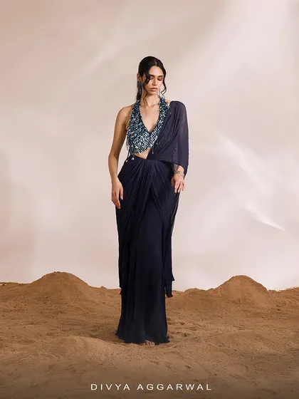 A full-length view of the Renee Saree Set, showcasing the tailored drapes and the modern, edgy feel of the ensemble.
