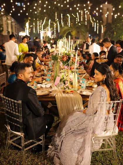A candid moment from a wedding reception I catered. The beautifully decorated long table, happy guests, and elegant seating arrangement all contribute to a memorable and joyous atmosphere.