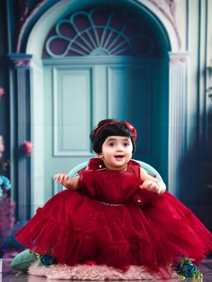 A wide view of the princess-themed first birthday shoot, with a magical, floral doorway backdrop.