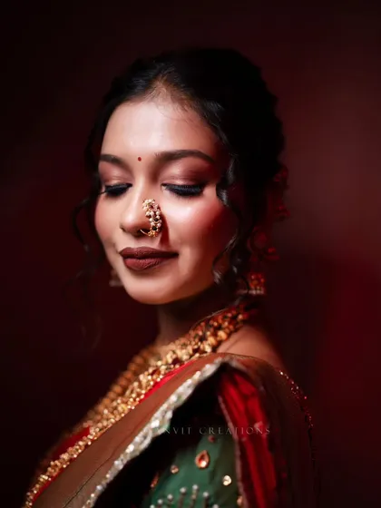 *जरतारी काठ, नव्वारी थाट*. A bride's portrait is more than a photo; it's a story of heritage and grace. I use light and shadow to highlight the intricate details and the bride's serene beauty.