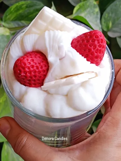 An overhead view of the strawberry and cream dessert candle.