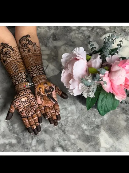 A beautifully staged photo of a completed Teej henna design, showing the rich color and intricate details.