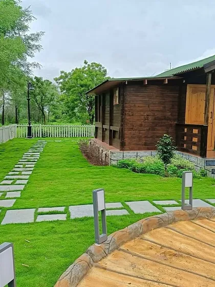 A view of the finished lawn and pathways at the farmhouse project. I use quality turf and proper installation techniques to ensure the grass is healthy and even.