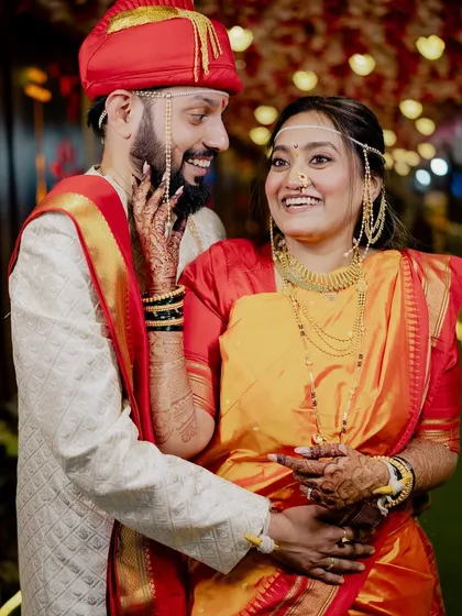 The couple shares a laugh, their joy is contagious.