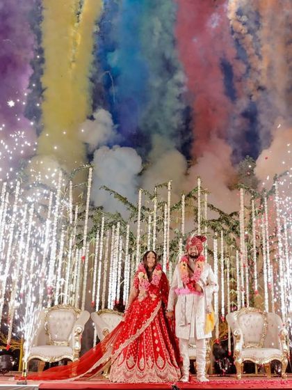 A spectacular shot of the bride and groom with fireworks. My HD makeup techniques ensure you look flawless even in dramatic, high-flash photography.