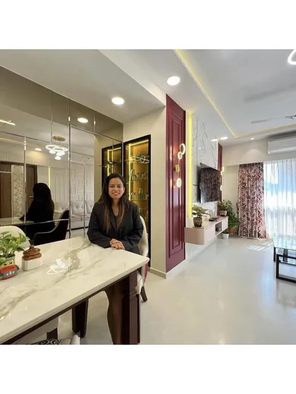 As the visionary behind the studio, I am personally involved in bringing each client's dream to life. Here I am in a recently completed project, a space that perfectly balances modern aesthetics with a warm, inviting feel.