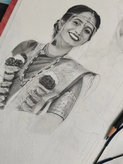 Another angle of the wedding portrait in progress. I am focusing on the intricate details of the bride's attire, using fine pencils to capture every element.
