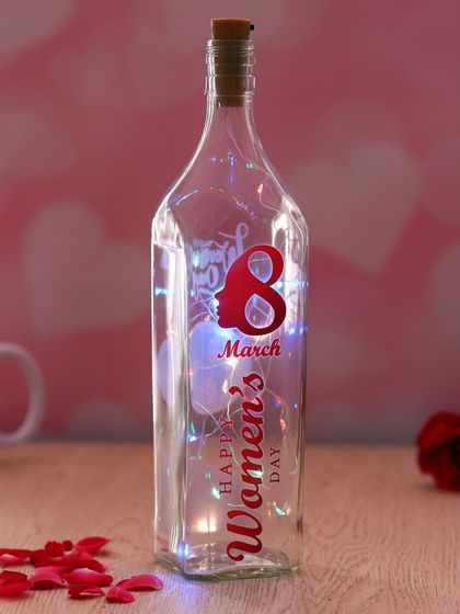 Celebrate International Women's Day with this special edition bottle lamp. It features a "Happy 8th March Women's Day" design and is filled with colorful fairy lights.