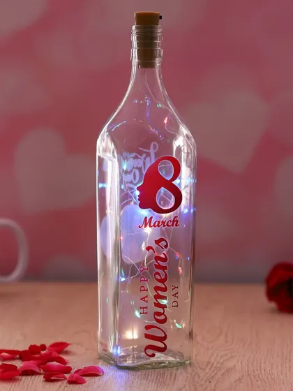 Celebrate International Women's Day with this special edition bottle lamp. It features a "Happy 8th March Women's Day" design and is filled with colorful fairy lights.