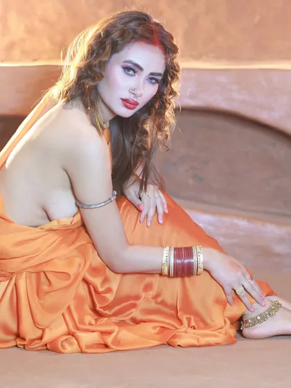 A side profile shot that showcases the unique, blouseless draping of the saree. This is for collaborators who want to create something edgy and different.
