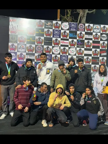 This is our family. A team of champions celebrating a massive haul of medals at the Elite Combat MMA championship in Ajmer. We train together, we win together.