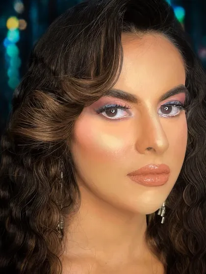The complete evening glam look, set against a bokeh background to show how it would appear in a nighttime setting.