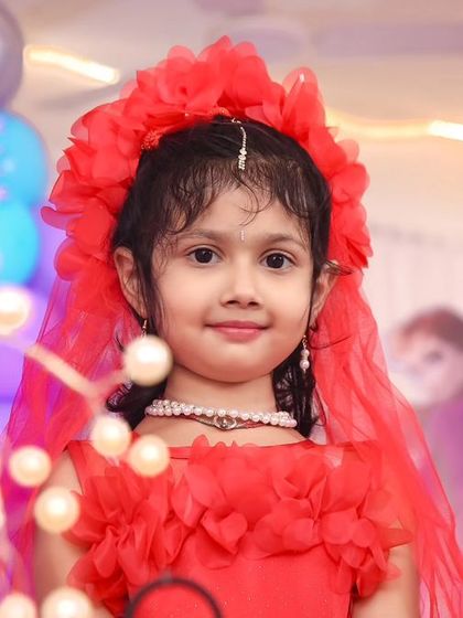 A magical 'Princess' themed birthday party, with elegant decor, shimmering backdrops, and royal props, making every little girl feel like royalty.