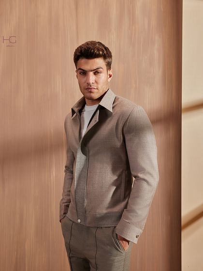 A neutral color palette makes a strong statement, especially for winter. This coordinated set is a perfect example of minimalist menswear that is both elegant and modern.