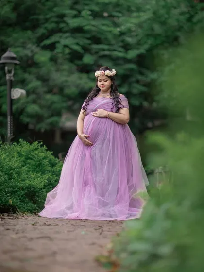 A dreamy solo portrait in a lavender gown. The soft focus and natural path create a whimsical, fairy-tale atmosphere.