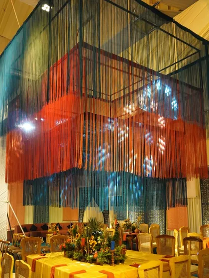A unique, multi-layered fringe chandelier created for a family dinner table at the 'Moroccan Nightfall' event.