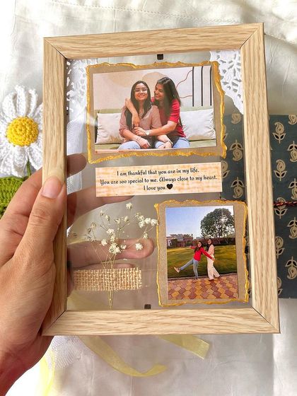 A close-up of our vintage transparent frame, customized for a special occasion. You can add photos, messages, and even dried flowers to make it unique.