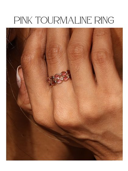 The Pink Tourmaline Ring, featuring a band of vibrant pink stones. It's a perfect ring for adding a pop of color to your stack.