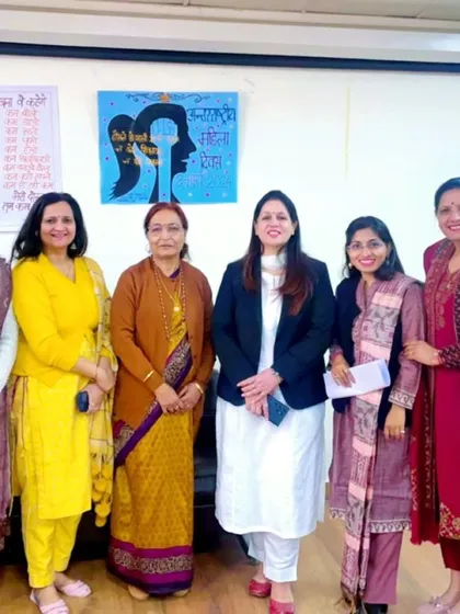 The artwork in the background, created by students, adds so much meaning to our session on women's rights and empowerment.