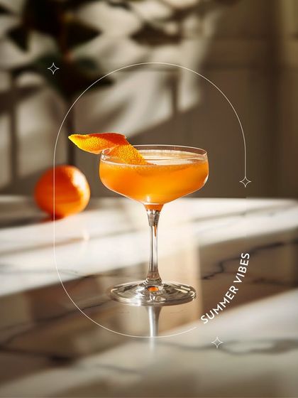 Another look at our refreshing orange mocktail, capturing the play of light and shadow. Each sip is crafted to be a sophisticated and flavorful experience.