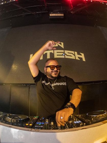 A fisheye lens view from the DJ booth, capturing the entire vibe of the club. My name on the screen and a full house in front of me is the perfect setup.