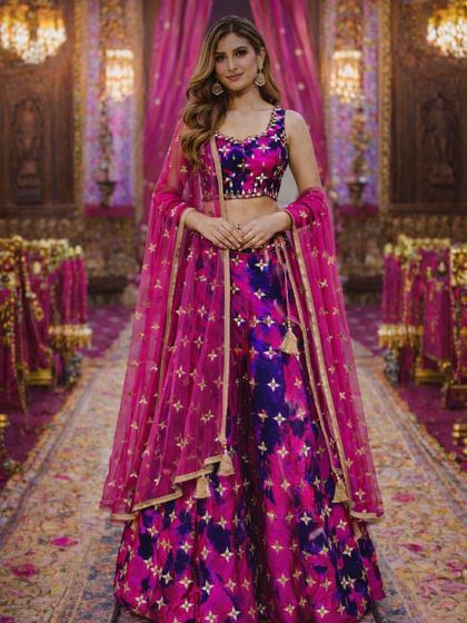 A classic pose in a vibrant and modern lehenga, perfect for a bridesmaid or a bride who wants a pop of color for her pre-wedding functions.