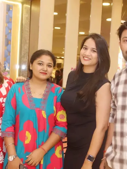 A group of friends smiling for a photo at a party. I capture the energy and camaraderie of your guests.