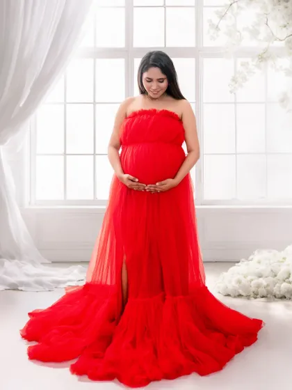 A heavenly, light-filled portrait. Using a bright window, sheer curtains, and a floor of soft clouds, I can make you look and feel angelic in this beautiful red gown.