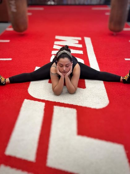 A moment of reflection during a cool-down stretch. Discipline in fitness mirrors the discipline needed for vocal training.