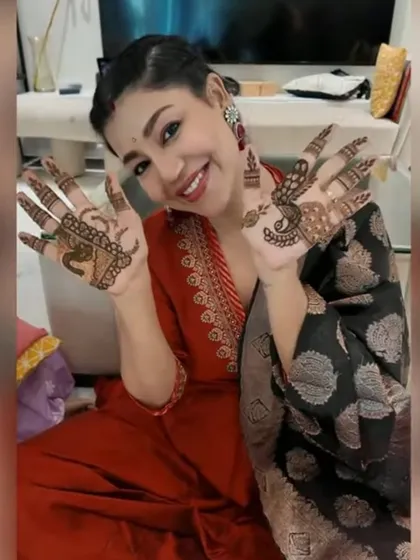 I had a wonderful time doing Karwa Chauth mehendi for the lovely actress Debina Bonnerjee. Here she is, happily showing off her festive henna, which features classic peacock and floral motifs.