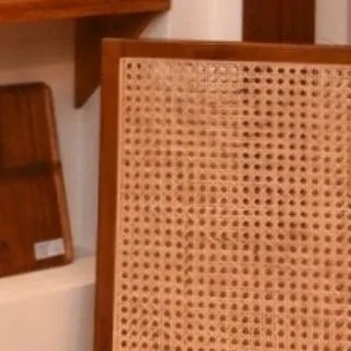 A detail of the joinery and rattan panel on a piece from my collection. This is where you can feel the beauty of teak and the care that goes into the craft.