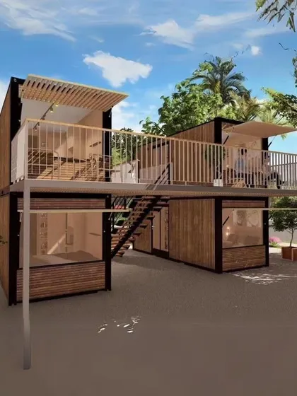 A beautiful double-decker container house design. This concept includes a large shared balcony and extensive use of wood cladding for a warm, modern aesthetic.