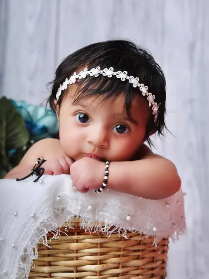 A duplicate of 120, this shot captures the baby's intense and curious gaze, making for a very engaging portrait.