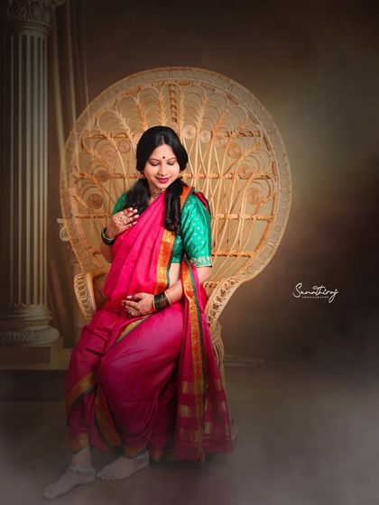 Seated on a peacock chair, this mother-to-be looks regal in her pink and green saree. The misty effect adds a dreamy quality to this traditional and elegant portrait.