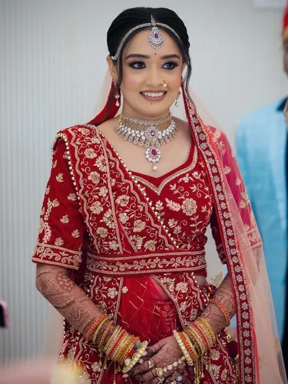 A full view of the bride's belted lehenga, showcasing the modern take on a traditional outfit.