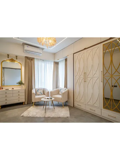 A closer look at the seating and wardrobe area. The combination of classic furniture shapes with modern, clean lines creates our signature modern-classic aesthetic.