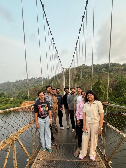 Posing on the suspension bridge in Honnavar, a scenic spot we visit on our Gokarna tours.