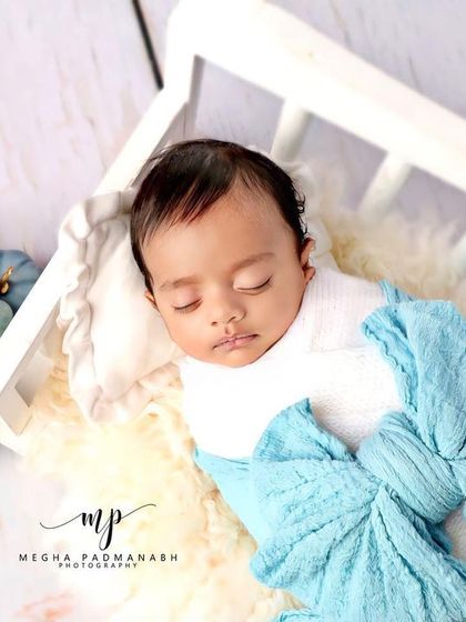 A top-down view of the baby on the bench.