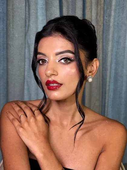 This portrait captures the confidence and allure of a classic Hollywood-inspired makeup look.